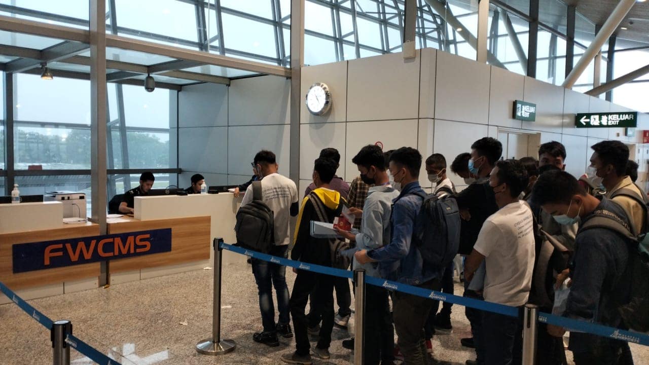 Myanmar nationals being served at the FWCMS one-stop processing counter
